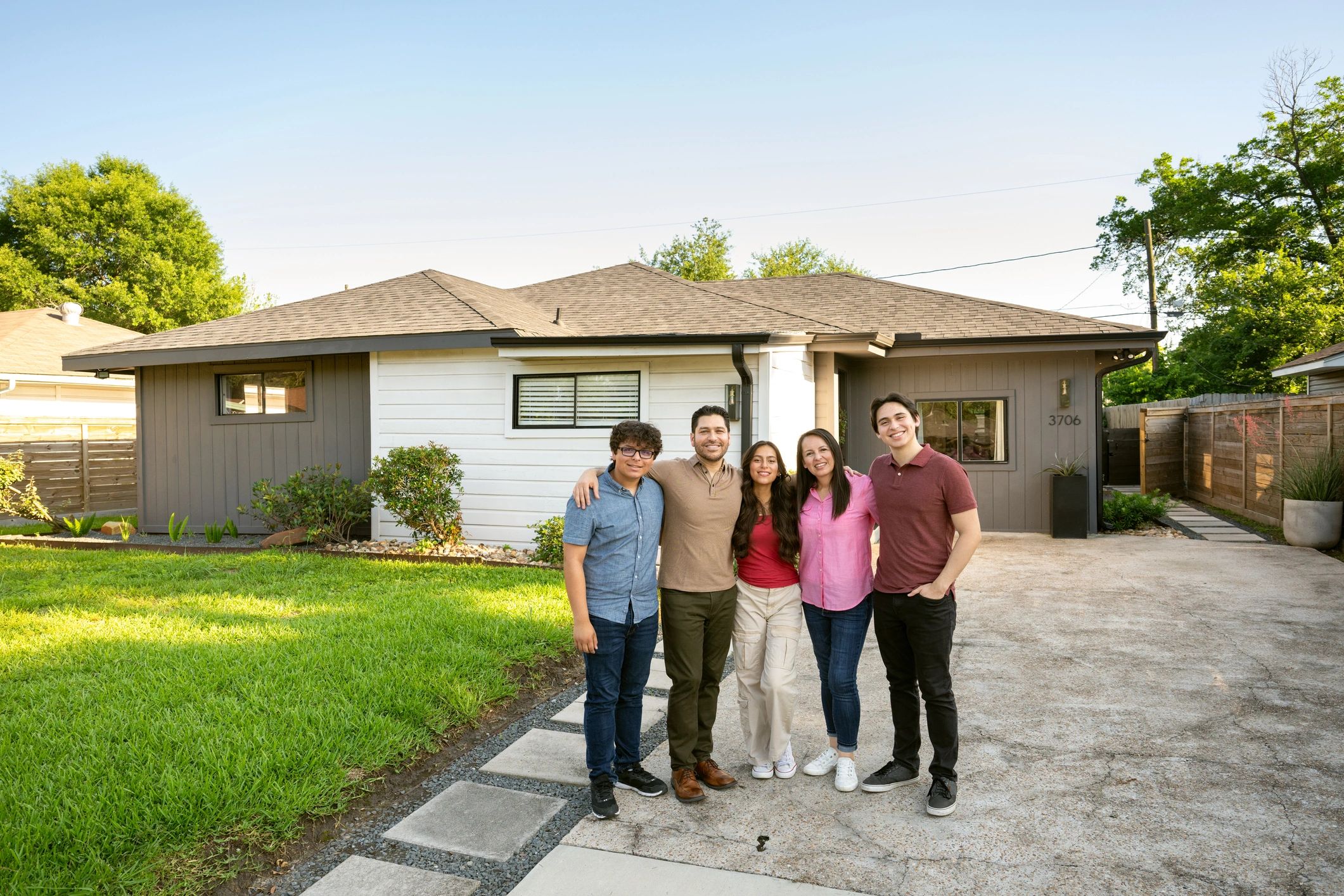 Local family outside their home