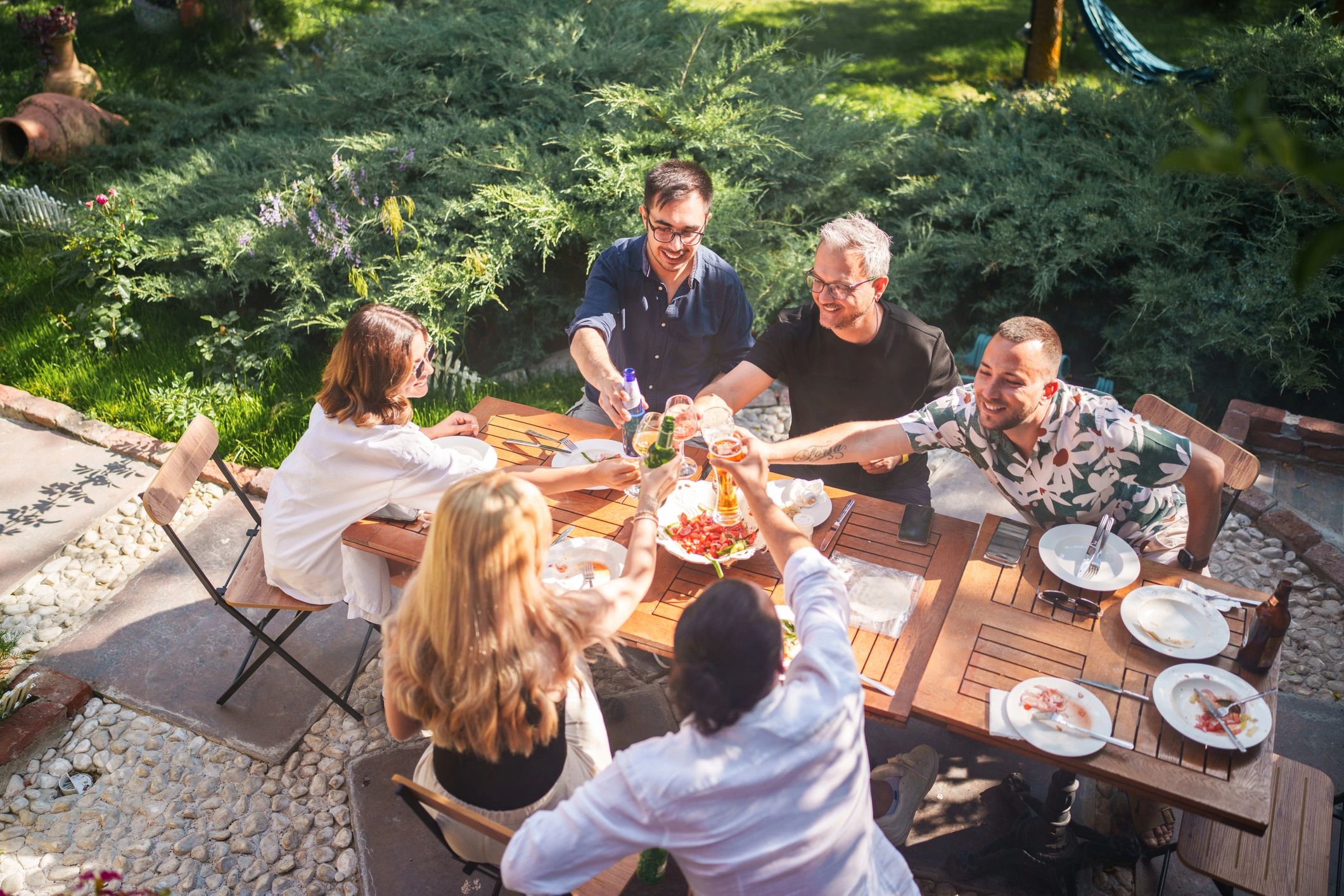 People enjoying time together outdoors in a backyard
